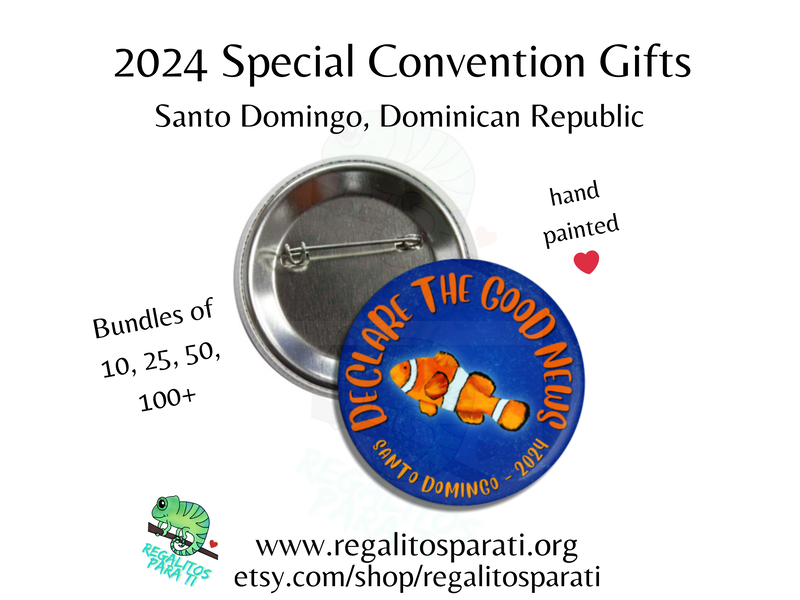 Pin back button with a hand painted clown fish design and the text "Declare the Good News Santo Domingo 2024"