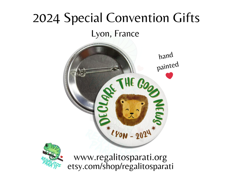 Pin back button with a hand painted lion and the text "Declare the Good News Lyon 2024"