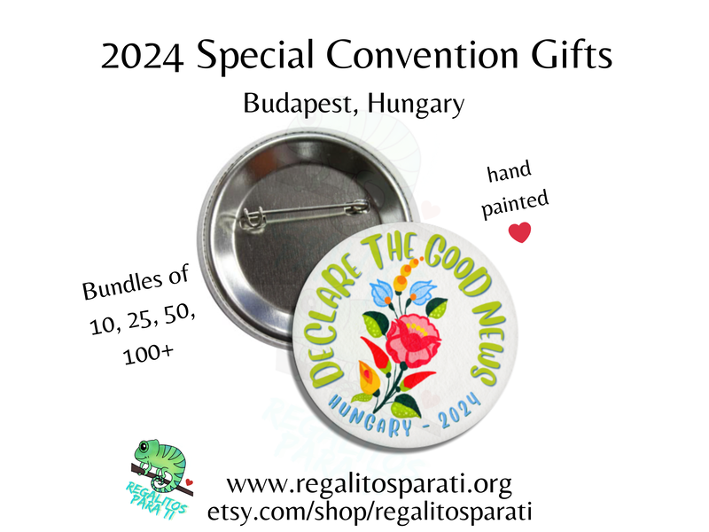 Pin back button with a hand painted floral design and the text "Declare the Good News Hungary 2024"