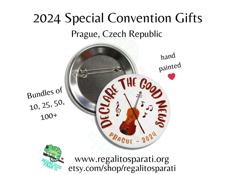Pin back button with a hand painted watercolor violin design and the text "Declare the Good News Prague 2024"