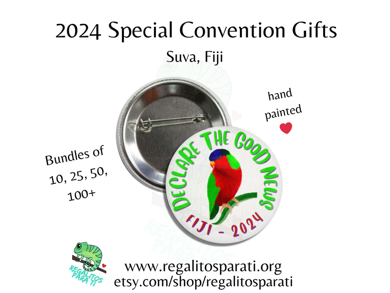 A button pin featuring a hand painted collard lory tropical bird surround by the text "Declare the Good News Fiji 2024"